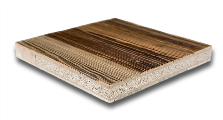 A close-up, angled cross-section of a composite wood panel. The top surface features a layer of reclaimed wood with a highly textured, strongly contrasting grain pattern in dark brown and charred-black tones